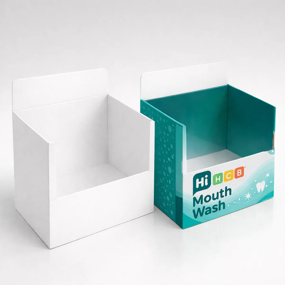Two cardboard counter display units- one minimalist white and the other with vibrant teal mouthwash branding- class=